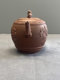 A Chinese Yixing stoneware teapot with relief design, Kangxi