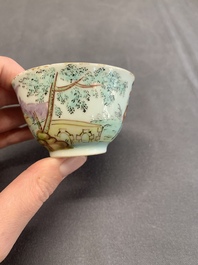 A Dutch-decorated Chinese porcelain cup and saucer with figures in a landscape, 18th C.