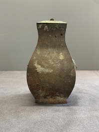 A Chinese bronze ritual wine vessel and cover, 'fang hu 方壺', Warring States Period