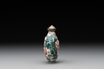 A Chinese famille rose relief-molded snuff bottle with an animated river landscape, Jiaqing mark and of the period