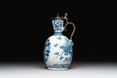 A Dutch Delft blue and white pewter-mounted armorial jug, late 17th C.