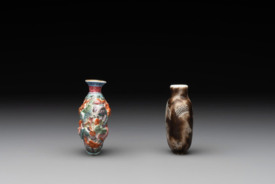 A Chinese famille rose molded 'Buddhist lions' and a grisaille 'dragon' snuff bottle, Qianlong and Daoguang mark, 19th C.