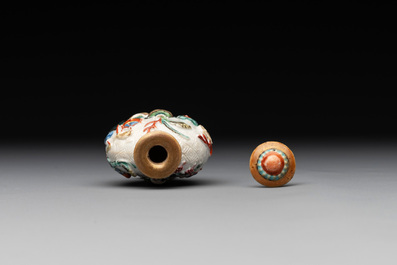 A Chinese molded famille rose 'antiquities' snuff bottle and porcelain stopper, Qianlong mark, 19th C.