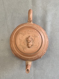 A Chinese Yixing stoneware teapot with relief design, Kangxi