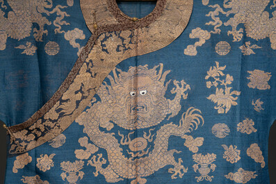 A Chinese embroidered silk blue-ground summer gauze 'nine dragons' robe, 19th C.