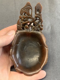 A rare Chinese carved rhinoceros horn 'libation cup' with grape design, 17/18th C.