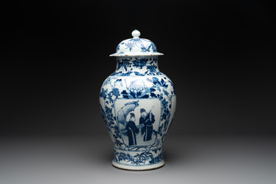 A pair of Chinese blue and white vases and covers with figural panels, 19th C.