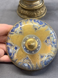 A Chinese gilt-ground blue and white lidded beaker on a French gilt bronze foot, Kangxi