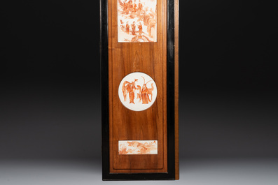 A Chinese four-part folding screen with iron-red-decorated porcelain plaques, 19/20th C.