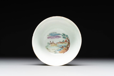 A Dutch-decorated Chinese porcelain cup and saucer with figures in a landscape, 18th C.