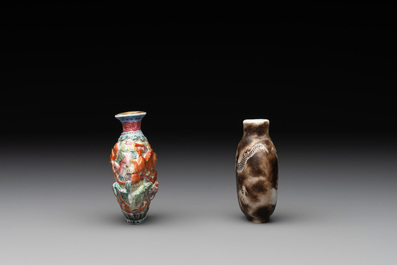 A Chinese famille rose molded 'Buddhist lions' and a grisaille 'dragon' snuff bottle, Qianlong and Daoguang mark, 19th C.