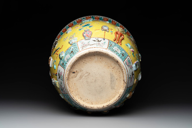 A Chinese famille rose yellow-ground relief-molded 'antiquities' fish bowl, Zhengde mark, 19th C.