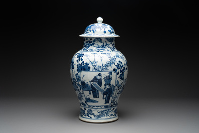 A pair of Chinese blue and white vases and covers with figural panels, 19th C.
