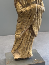 A Chinese gilt and polychromed stucco figure of a monk, Ming