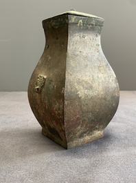 A Chinese bronze ritual wine vessel and cover, 'fang hu 方壺', Warring States Period