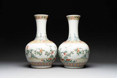 A pair of Chinese famille rose bottle vases with flowers, Qianlong mark, Republic