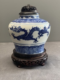 A Chinese blue and white 'dragon' vase with wooden cover and stand, Wanli mark, Republic