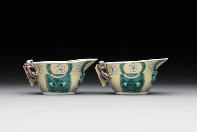 A pair of fine Chinese sancai-glazed 'Buddhist lion and chilong' libation cups, Kangxi