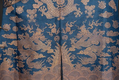 A Chinese embroidered silk blue-ground summer gauze 'nine dragons' robe, 19th C.