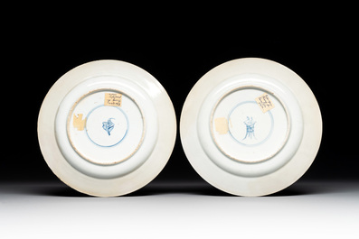 A pair of Chinese famille verte plates with figures along the riverside, artemisia leaf and ding mark, Kangxi