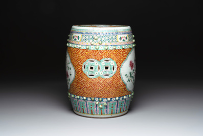 A Chinese famille rose garden seat with birds among flowering branches, 19th C.
