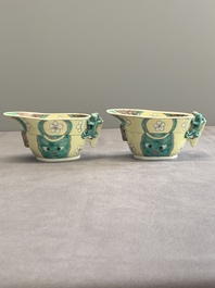 A pair of fine Chinese sancai-glazed 'Buddhist lion and chilong' libation cups, Kangxi