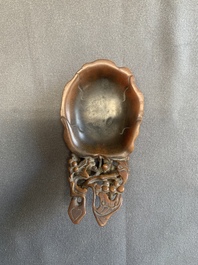 A rare Chinese carved rhinoceros horn 'libation cup' with grape design, 17/18th C.