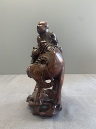A pair of Chinese carved bamboo groups of a boy riding a buffalo, 19/20th C.