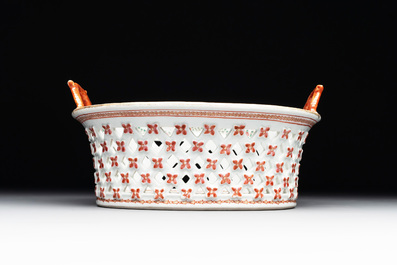 A Chinese openworked famille rose 'antiquities' basket and stand, Qianlong