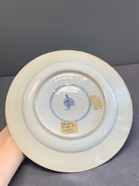 A pair of Chinese famille verte plates with figures along the riverside, artemisia leaf and ding mark, Kangxi