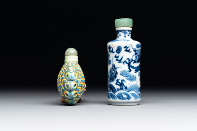 A Chinese blue and white 'dragon' snuff bottle and a polychrome 'peacock' snuff bottle, Yongzheng mark, 19/20th C.