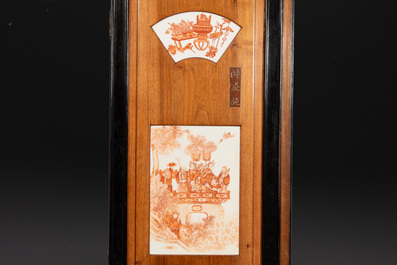 A Chinese four-part folding screen with iron-red-decorated porcelain plaques, 19/20th C.