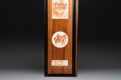 A Chinese four-part folding screen with iron-red-decorated porcelain plaques, 19/20th C.