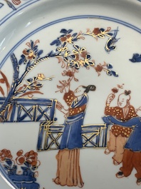 A Chinese Imari-style plate with figures in a garden, Kangxi/Yongzheng
