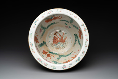 A Chinese famille rose yellow-ground relief-molded 'antiquities' fish bowl, Zhengde mark, 19th C.