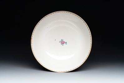 A Chinese Canton famille rose bowl with figures in a garden, Qianlong