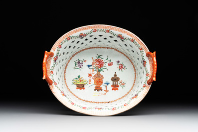 A Chinese openworked famille rose 'antiquities' basket and stand, Qianlong