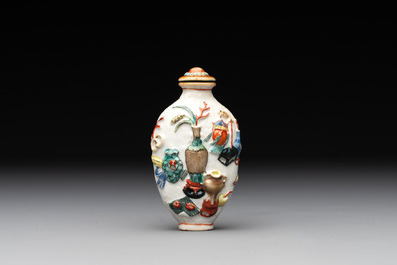 A Chinese molded famille rose 'antiquities' snuff bottle and porcelain stopper, Qianlong mark, 19th C.