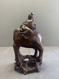 A pair of Chinese carved bamboo groups of a boy riding a buffalo, 19/20th C.