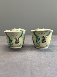A pair of fine Chinese sancai-glazed 'Buddhist lion and chilong' libation cups, Kangxi