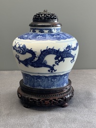 A Chinese blue and white 'dragon' vase with wooden cover and stand, Wanli mark, Republic