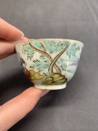A Dutch-decorated Chinese porcelain cup and saucer with figures in a landscape, 18th C.