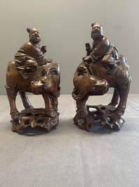 A pair of Chinese carved bamboo groups of a boy riding a buffalo, 19/20th C.