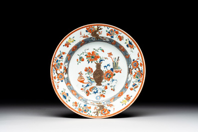 A Chinese famille rose 'antiquities' dish and two plates, Yongzheng/Qianlong