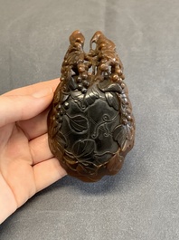 A rare Chinese carved rhinoceros horn 'libation cup' with grape design, 17/18th C.