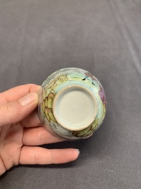 A Dutch-decorated Chinese porcelain cup and saucer with figures in a landscape, 18th C.