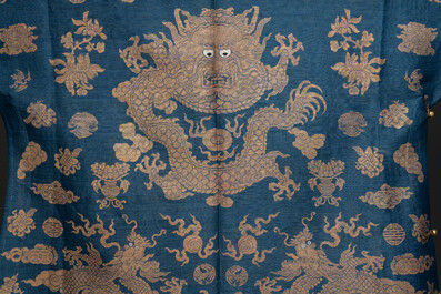 A Chinese embroidered silk blue-ground summer gauze 'nine dragons' robe, 19th C.