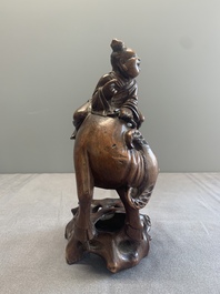 A pair of Chinese carved bamboo groups of a boy riding a buffalo, 19/20th C.
