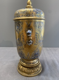 A Chinese gilt-ground blue and white lidded beaker on a French gilt bronze foot, Kangxi