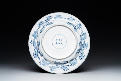 A Chinese blue and white 'Eight Immortals' dish, Xuande mark, 19th C.